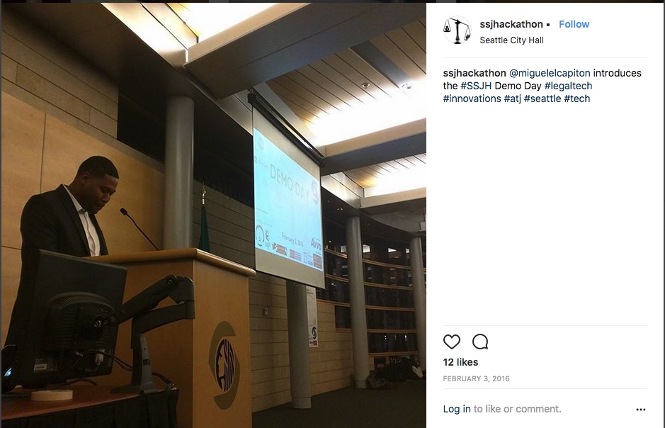 Instagram post - Miguel speaks in front of the Demo Day slideshow